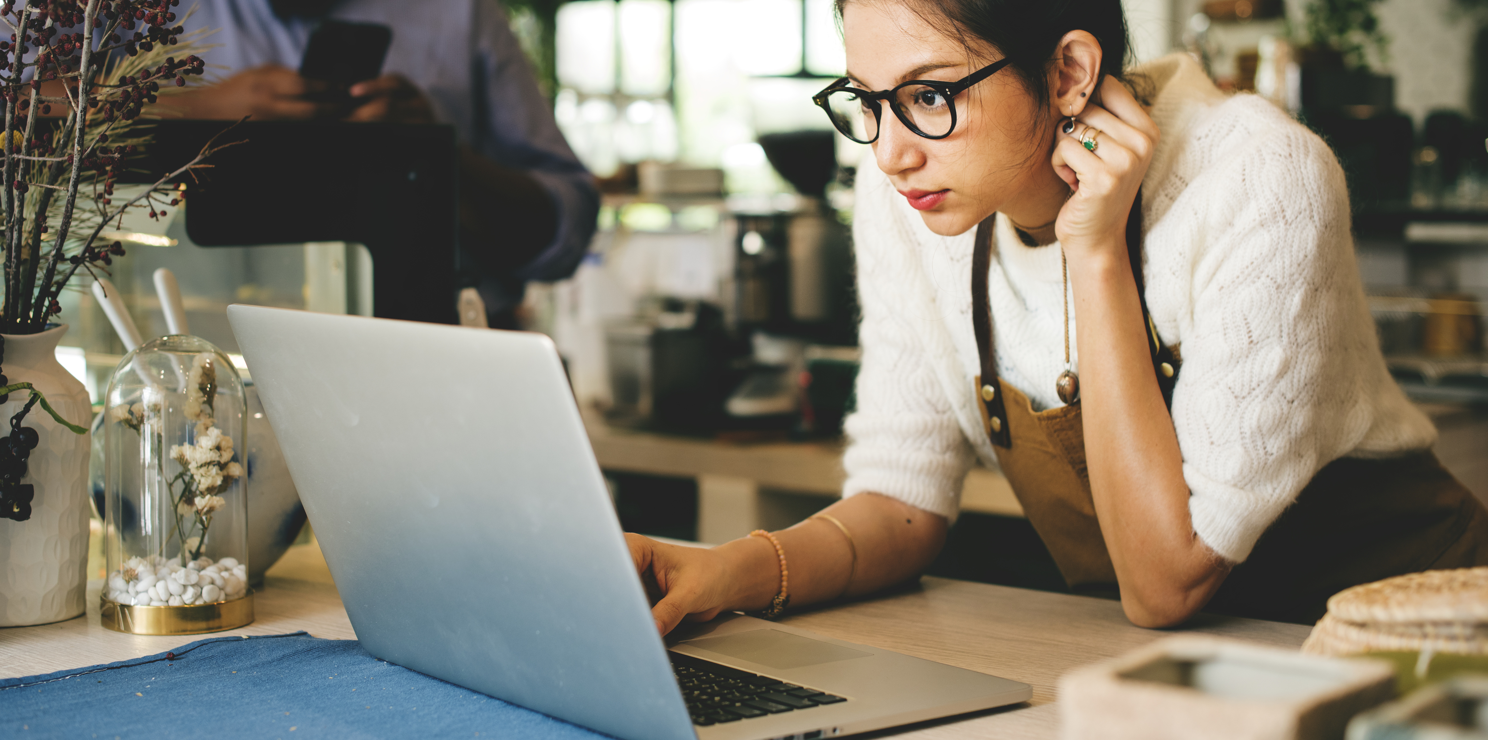 Business owner is using laptop