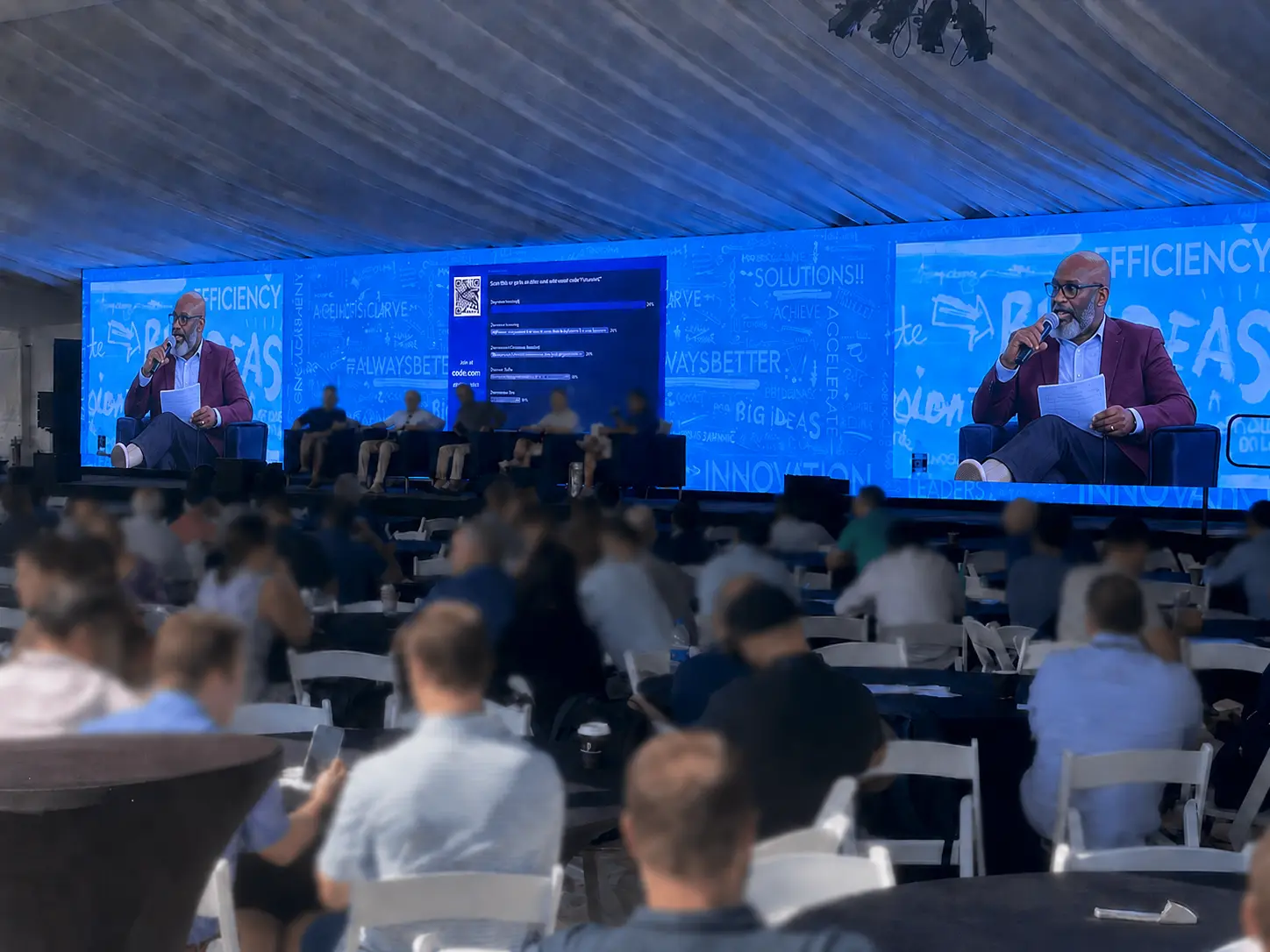 Attendees at a large business conference supported by event internet and Wi-Fi