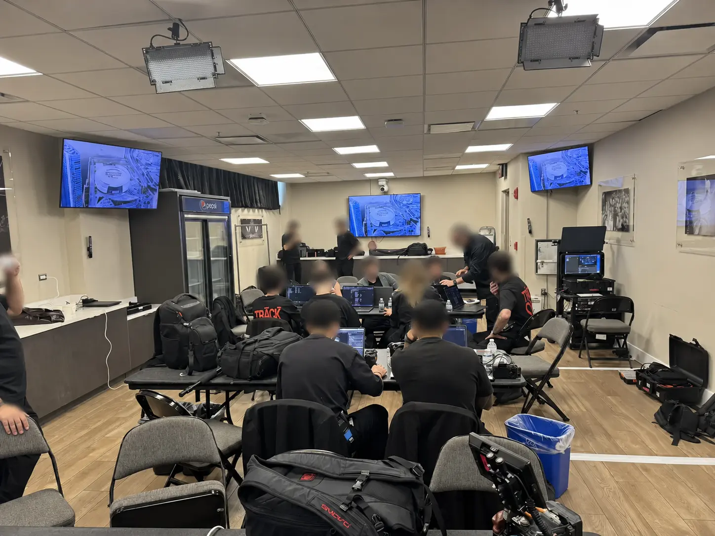 Production team coordinating event internet and broadcast connectivity